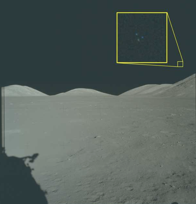 Apollo 12 lunar surface under a black sky, a yellow annotation box highlighting faint lights at top-right.