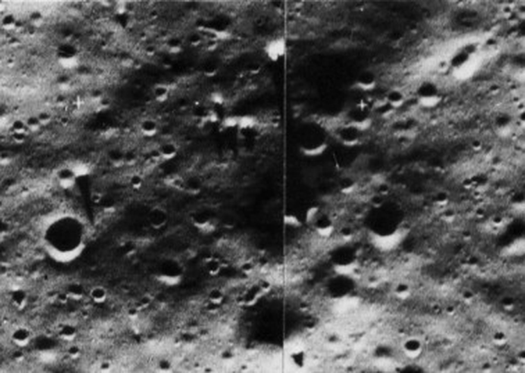 Lunar Orbiter II frame LO2-61H3: several bright objects casting long, narrow shadows across the Sea of Tranquillity under a low Sun.