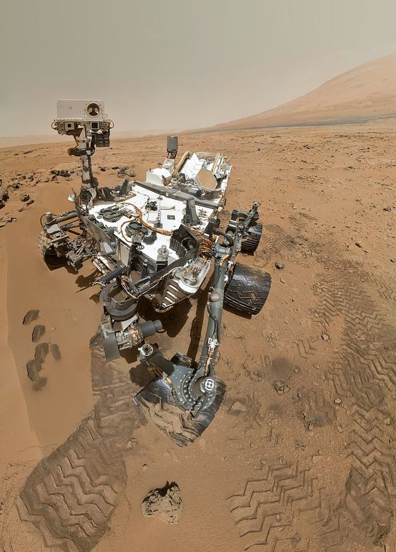 NASA/JPL Curiosity rover self-portrait on the floor of Gale Crater, Mars, the flank of Mount Sharp rising behind.